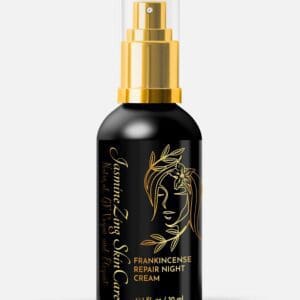 A bottle of hair serum with gold label.