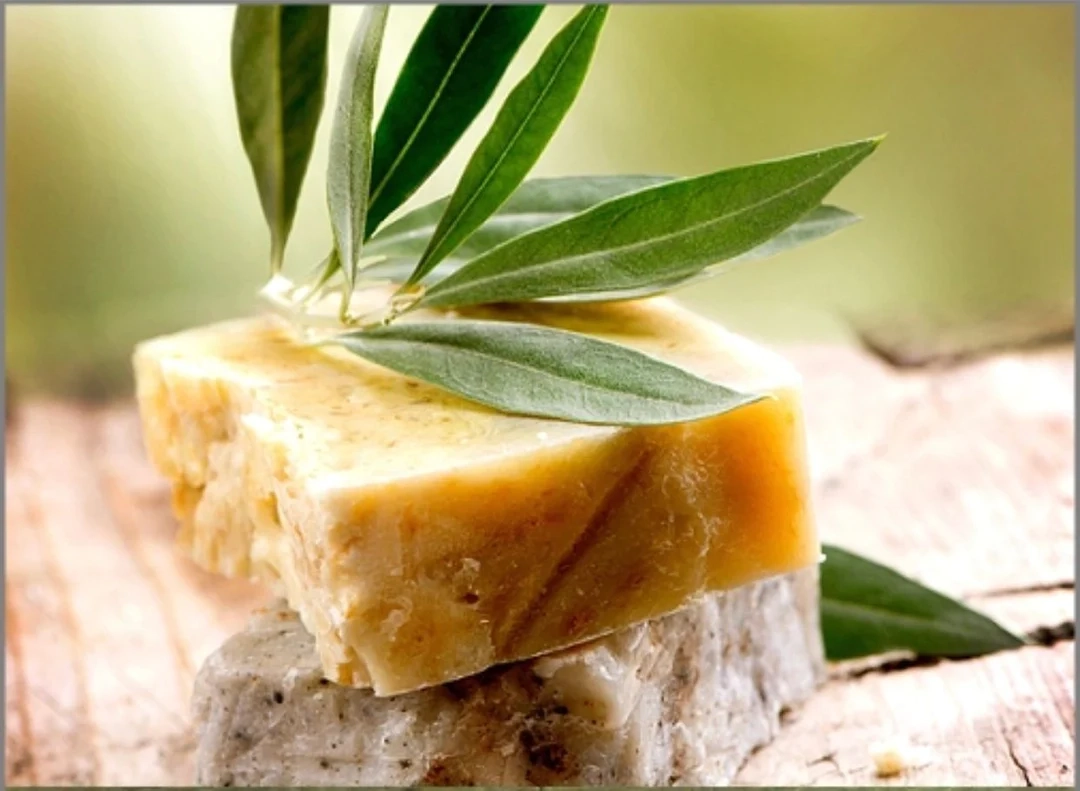 A piece of soap sitting on top of a wooden block.